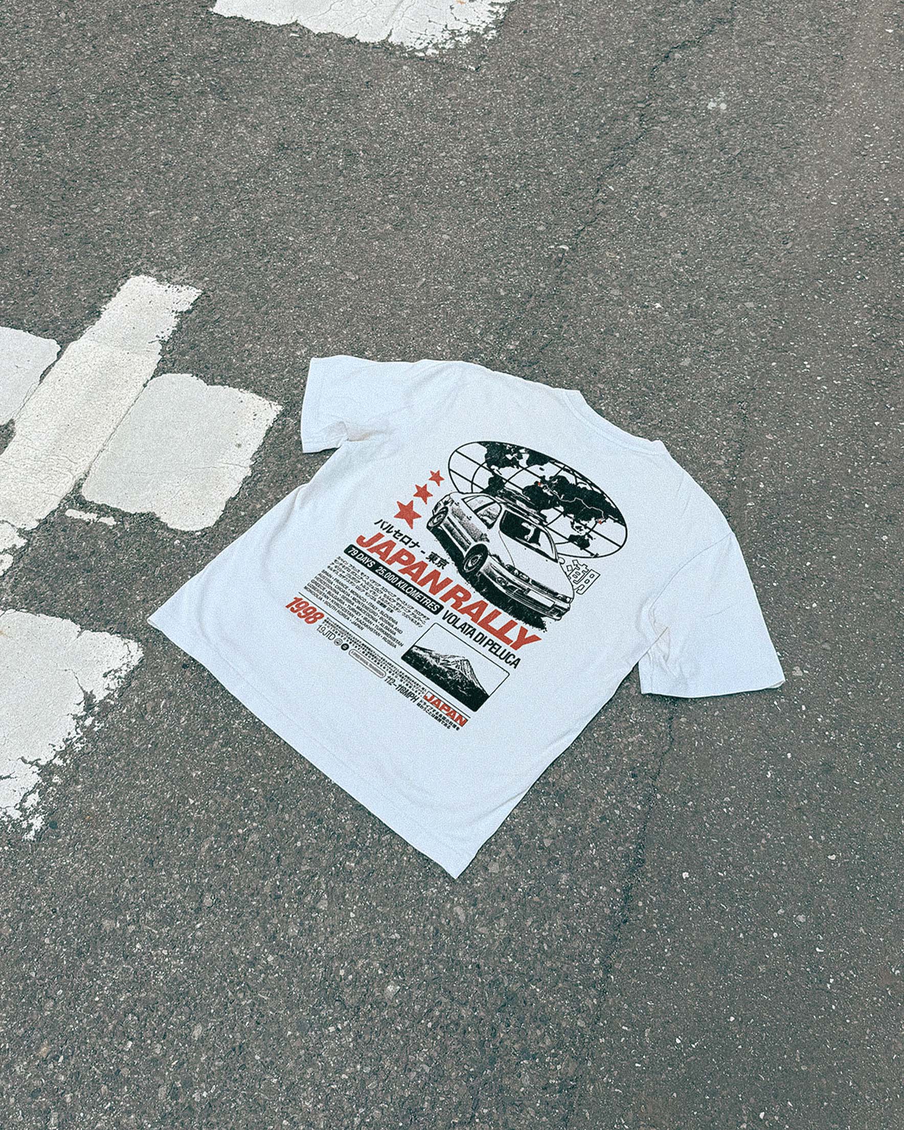 Volata Japan Rally t-shirt laid on a road